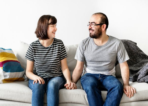 man and woman on couch