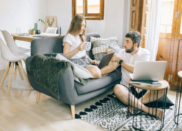 woman sitting on couch man sitting on floor